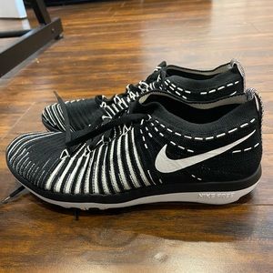 Black and white Nike training shoes women